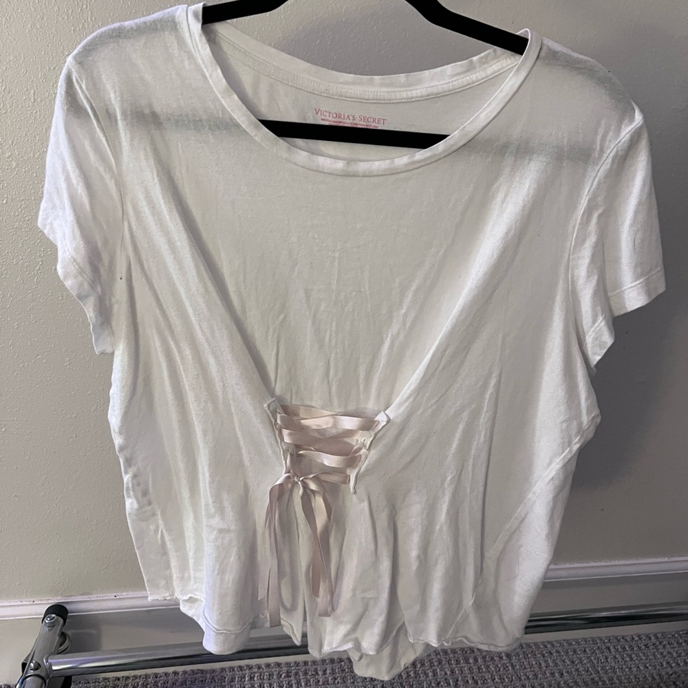Victoria’s Secret coquette lace corset tee in white with pale pink ribbon.